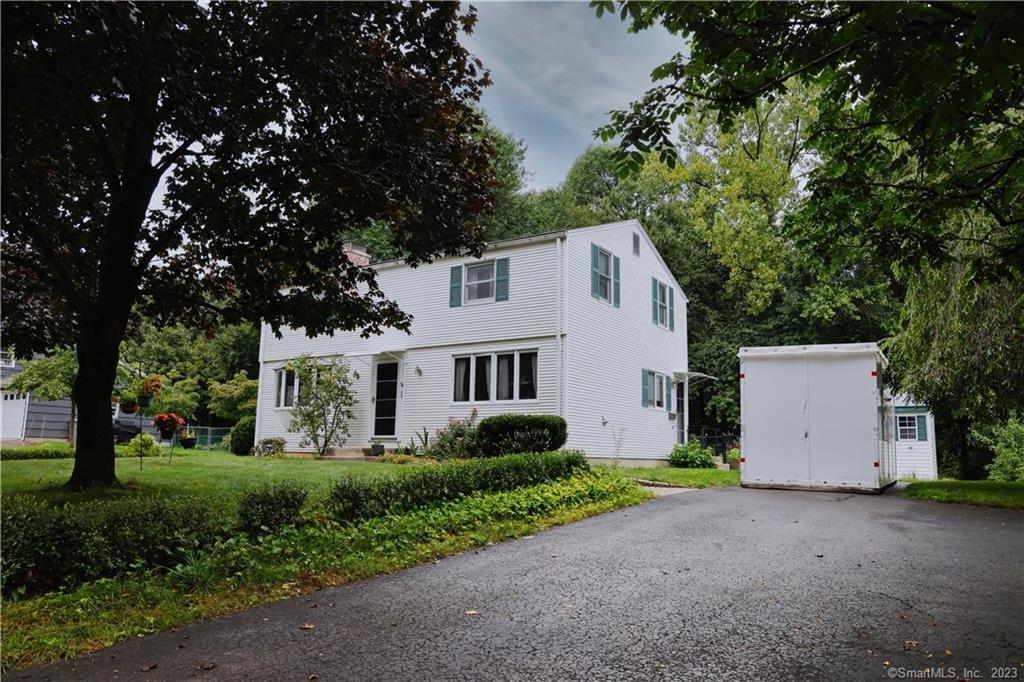 26 Ridge Road Enfield, CT 06082 - Photo 1 of 1 a front view of a house with a garden