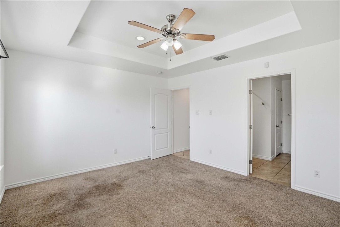 107 South 4th Street Odem, TX 78370 - Photo 15 of 29 an empty room with fan and a ceiling fan