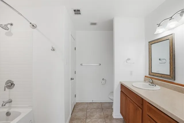 a bathroom with a sink a mirror and a bathtub