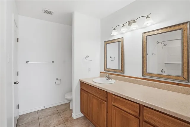 a bathroom with a sink a vanity and a mirror