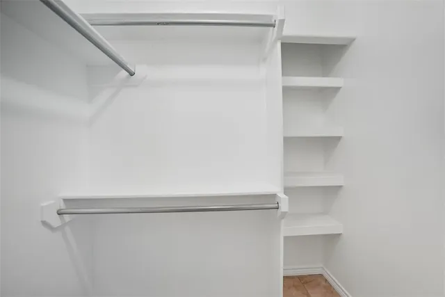 a view of an empty walk in closet