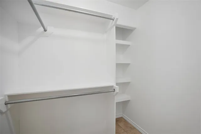a view of an empty walk in closet