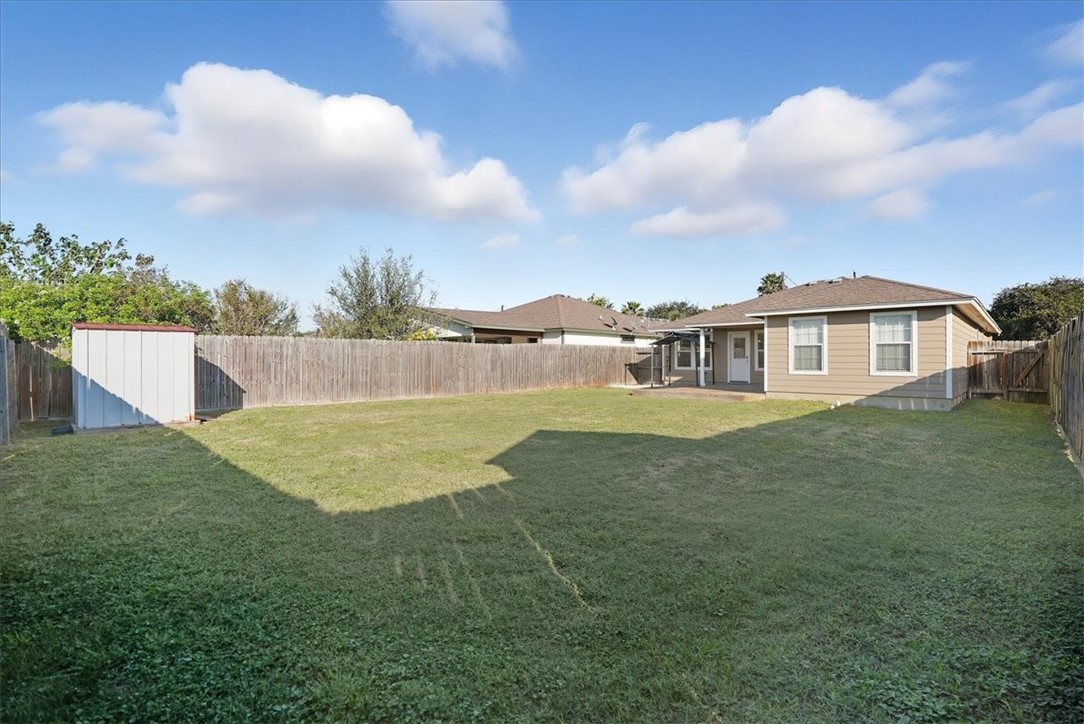 107 South 4th Street Odem, TX 78370 - Photo 28 of 29 a view of a house with a backyard