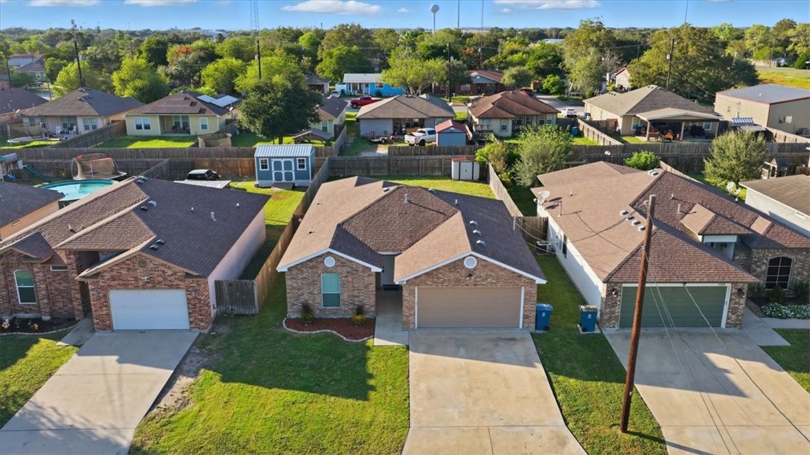 107 South 4th Street Odem, TX 78370 - Photo 4 of 29 an aerial view of multiple houses with yard