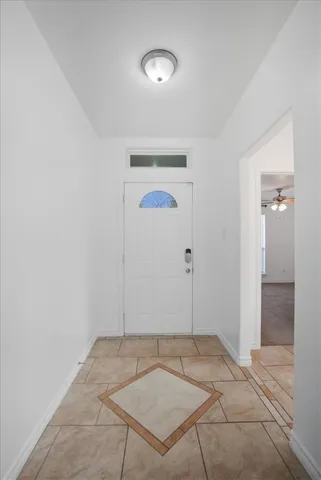 an empty room with closet and wooden floor