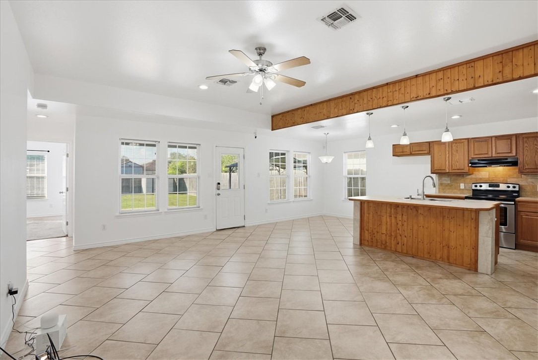 107 South 4th Street Odem, TX 78370 - Photo 6 of 29 a view of kitchen with windows and ceiling fan