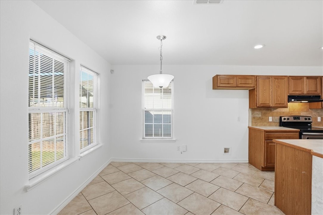 107 South 4th Street Odem, TX 78370 - Photo 9 of 29 a view of a kitchen with windows