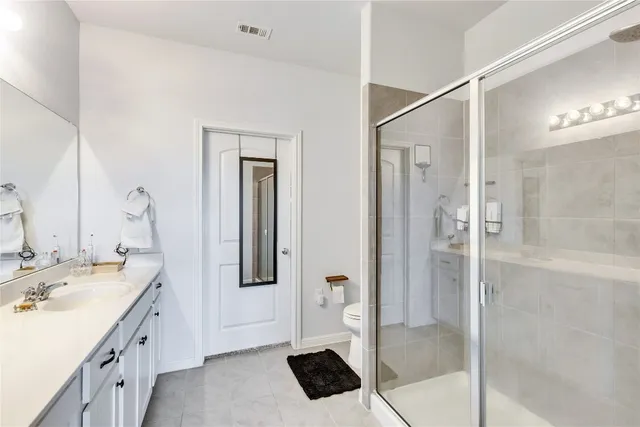 a bathroom with a tub sink and shower