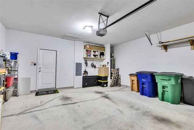 a spacious bedroom with a large bed and a large mirror