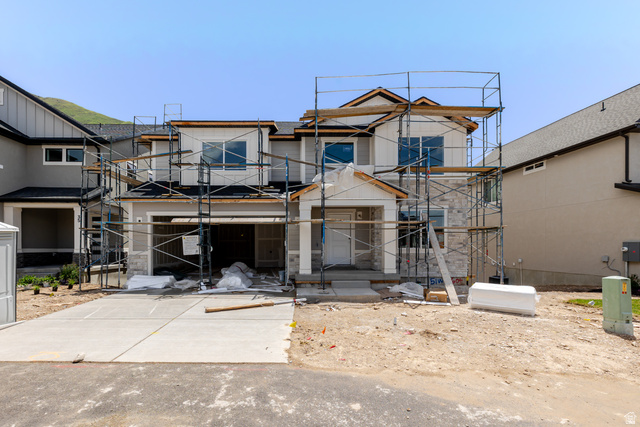 51 West Harmony Rdg Parkway, Unit 604 Mapleton, UT 84664 - Photo 1 of 5 Contemporary two-story residence under construction, featuring a stone and siding exterior