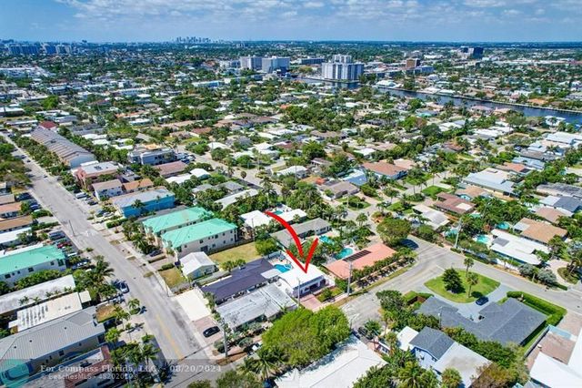 a front view of a house with yard and green space