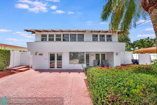 a view of a chairs and table in the balcony