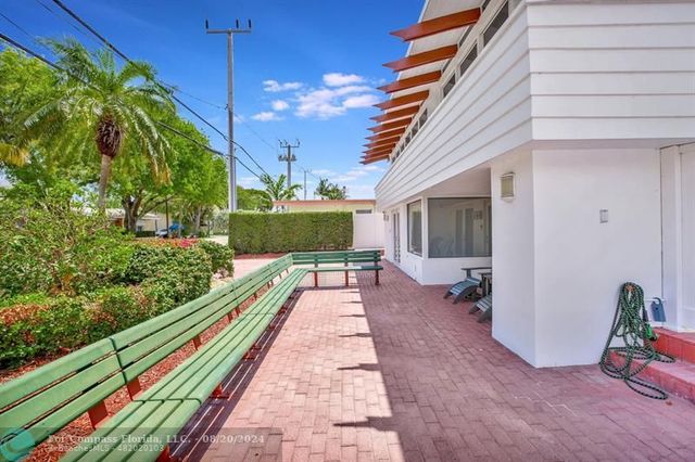 a view of a hallway with seating area