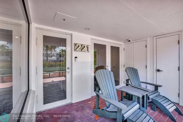a room with lots of tables and a large window