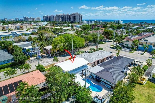 an aerial view of a houses with outdoor space and street view