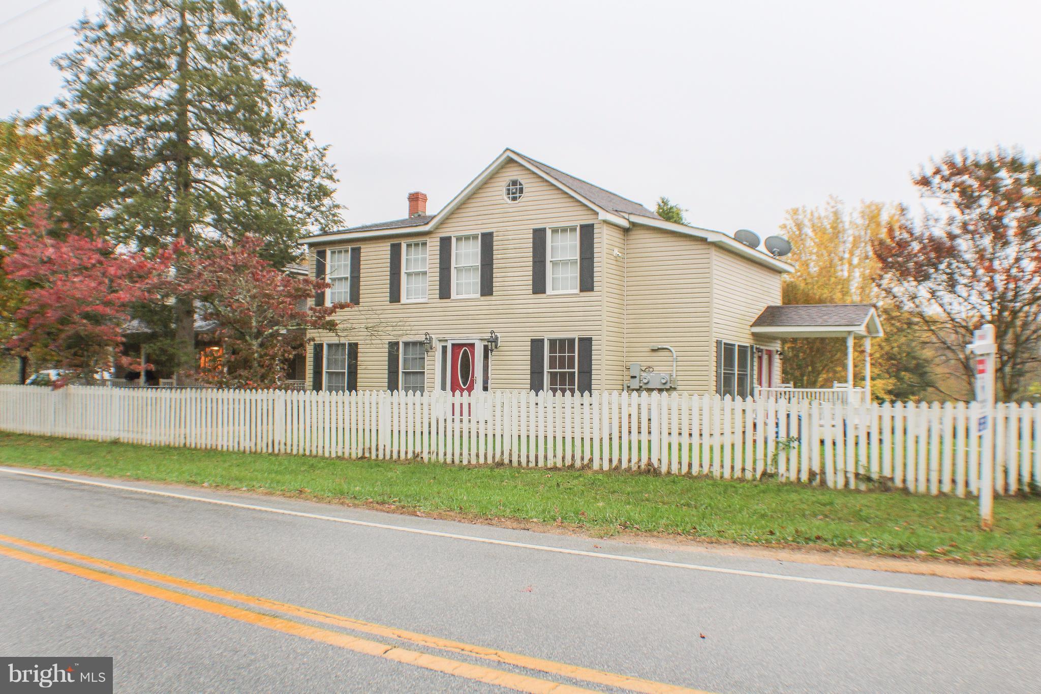 4155 Smallwood Church Road Indian Head, MD 20640 - Photo 1 of 30 a view of a white house with a small yard and large trees