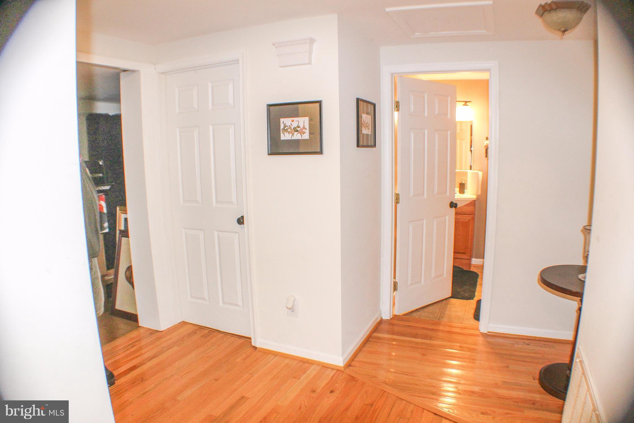 4155 Smallwood Church Road Indian Head, MD 20640 - Photo 13 of 30 a view of a bedroom with wooden floor and bathroom