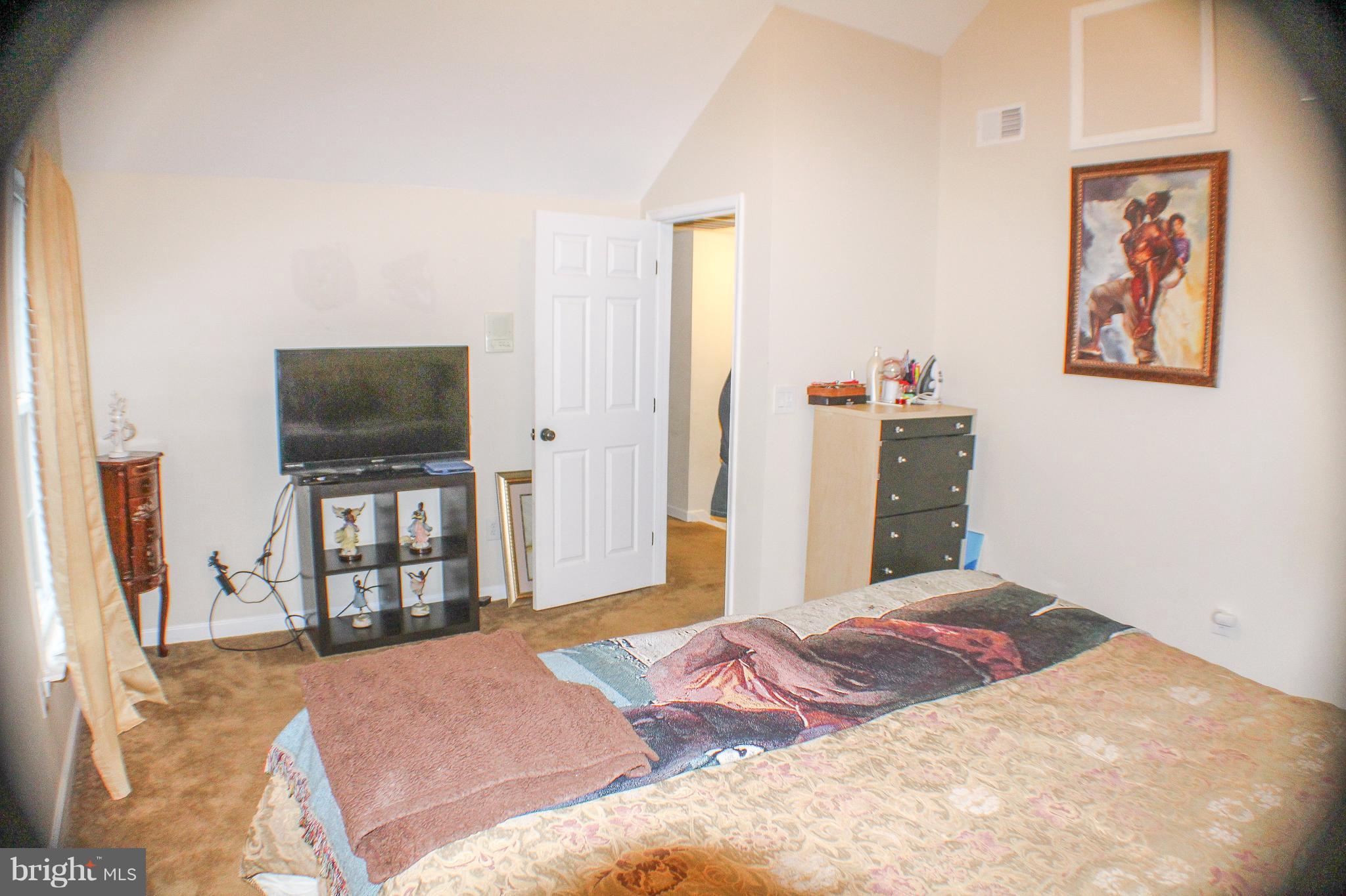 4155 Smallwood Church Road Indian Head, MD 20640 - Photo 16 of 30 a bedroom with a bed and a flat screen tv