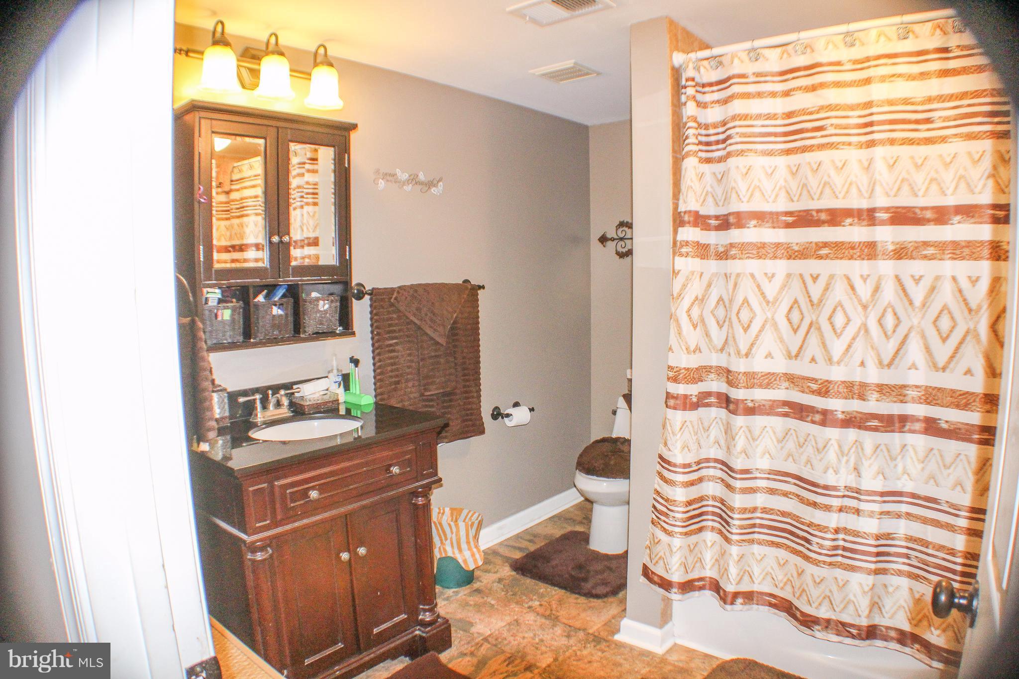 4155 Smallwood Church Road Indian Head, MD 20640 - Photo 18 of 30 a room with a window and mirror