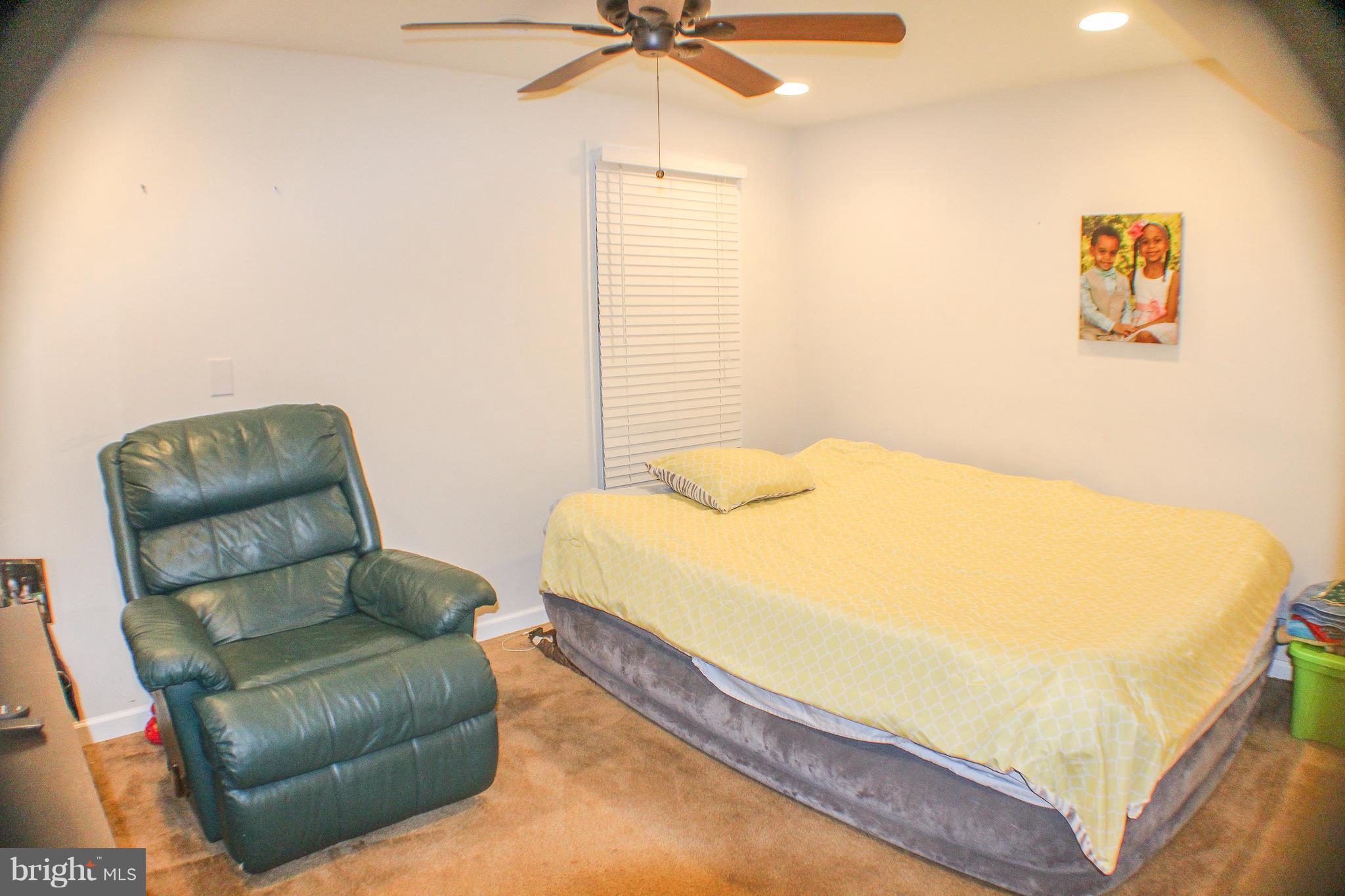 4155 Smallwood Church Road Indian Head, MD 20640 - Photo 20 of 30 a bedroom with a bed couch and window