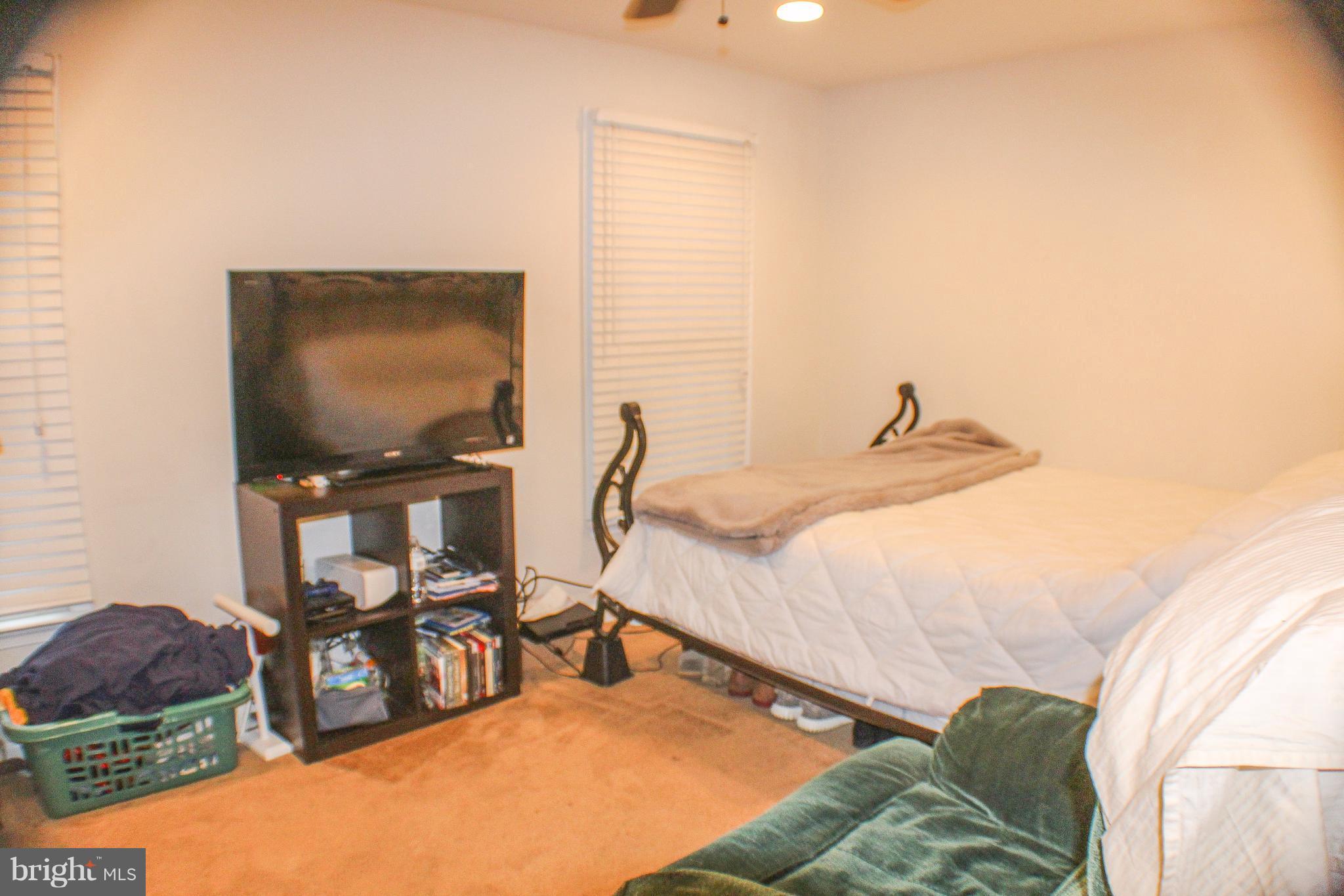 4155 Smallwood Church Road Indian Head, MD 20640 - Photo 21 of 30 a bedroom with a bed and a cabinets