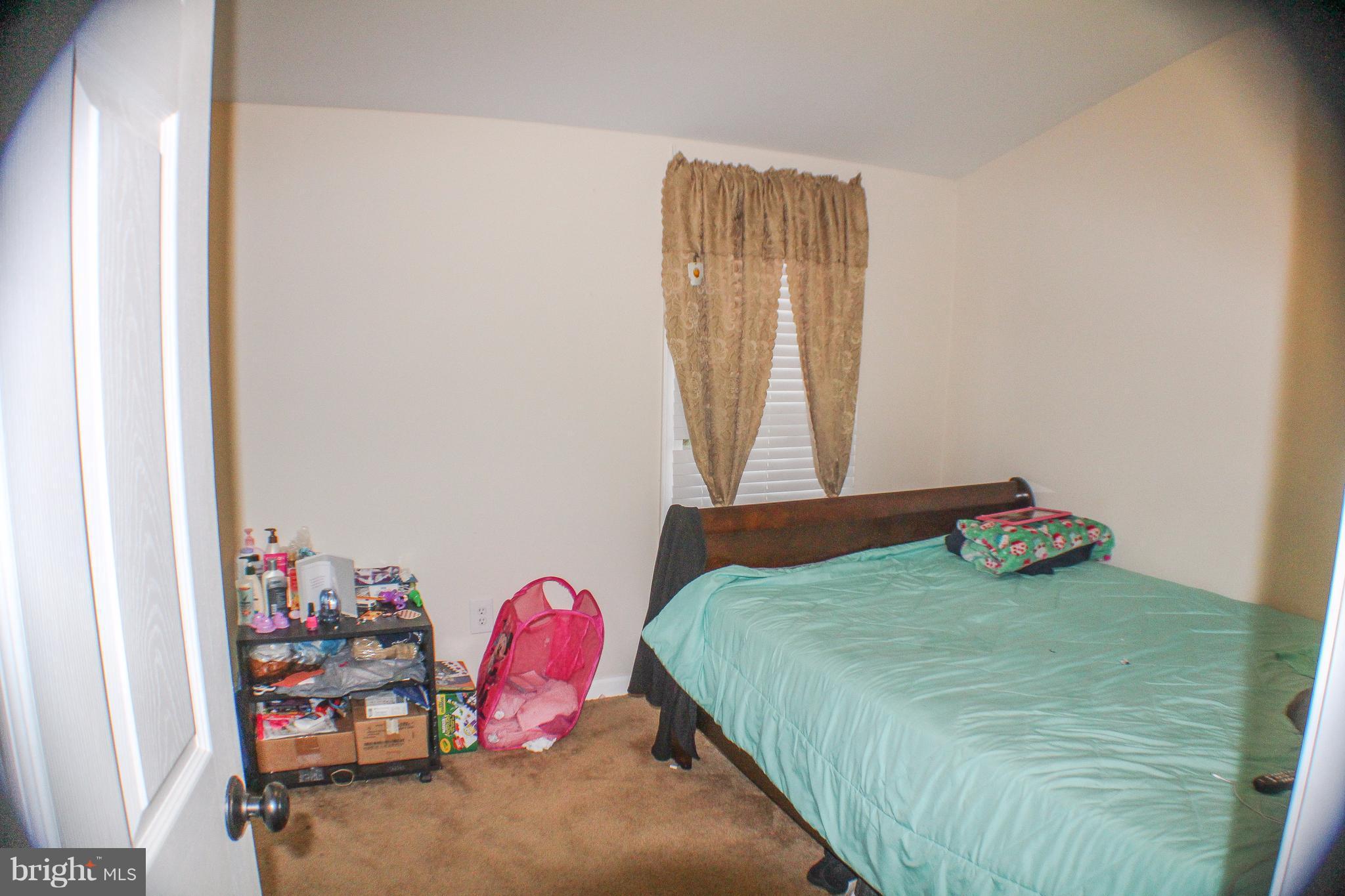 4155 Smallwood Church Road Indian Head, MD 20640 - Photo 23 of 30 a bedroom with a bed and a window