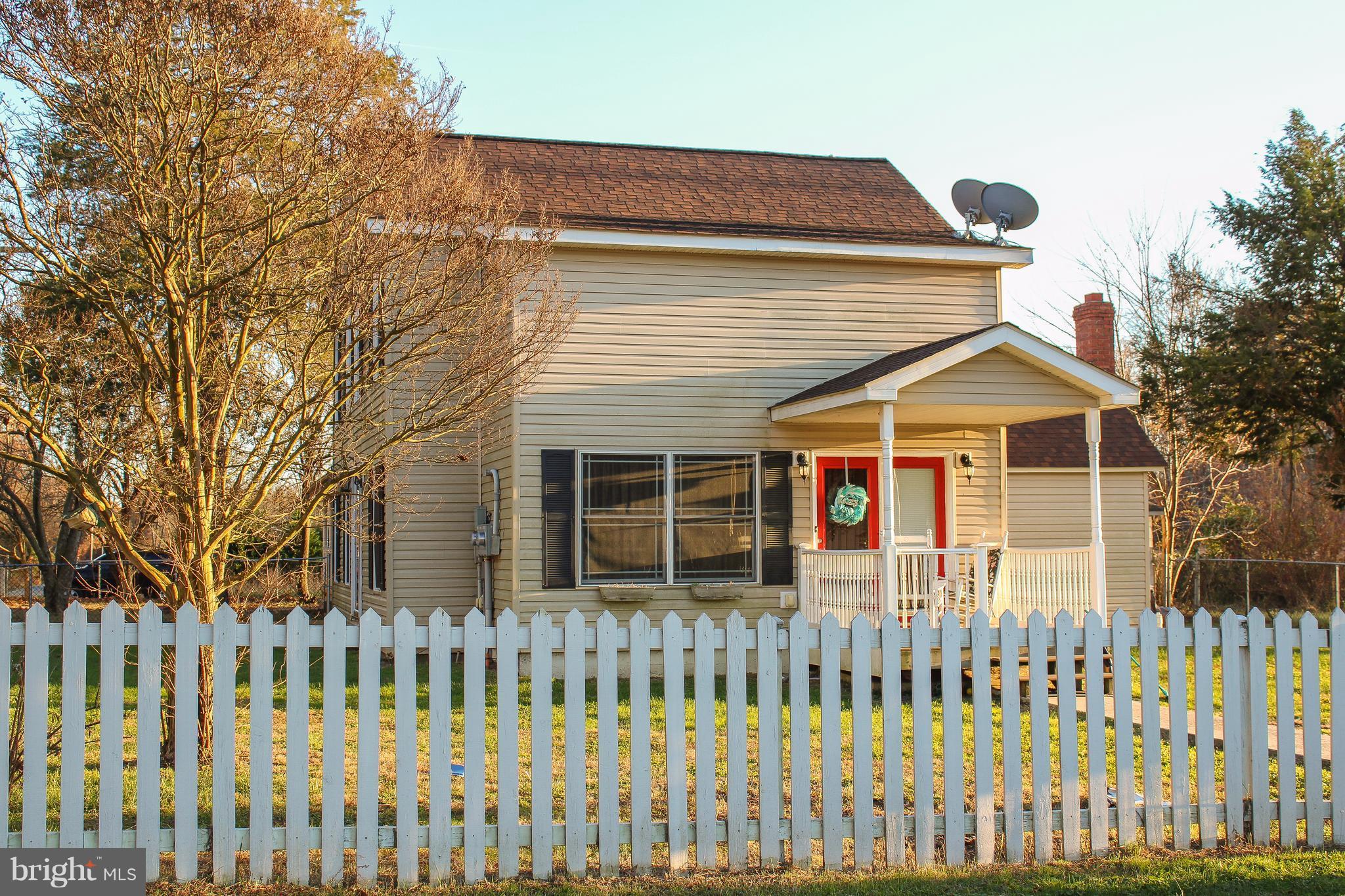 4155 Smallwood Church Road Indian Head, MD 20640 - Photo 4 of 30 a front view of a house with a garden