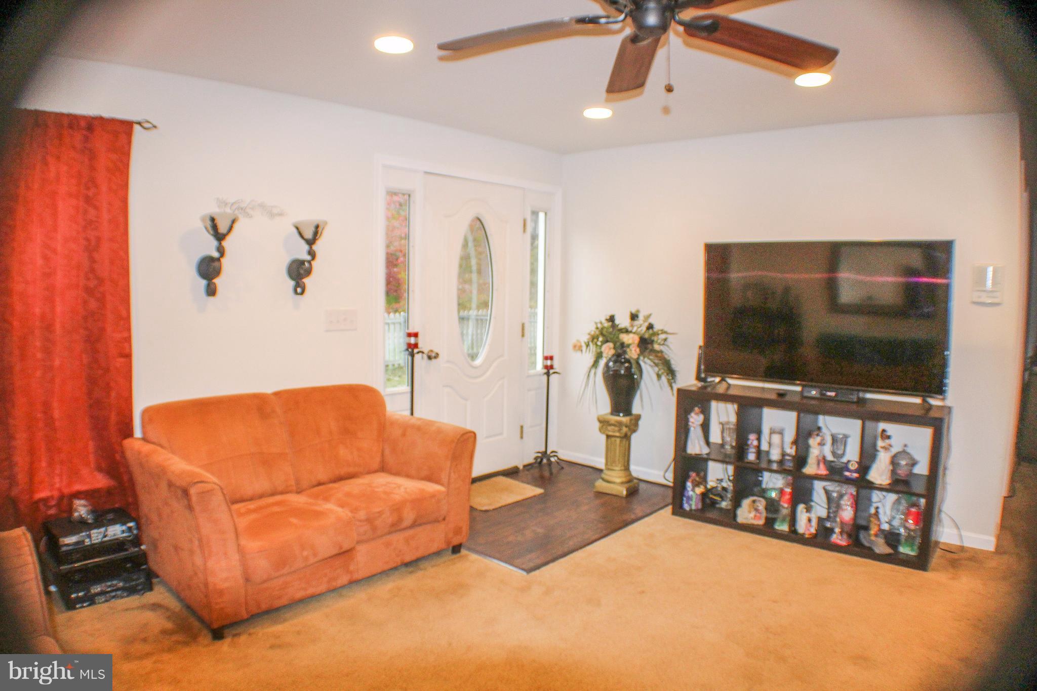 4155 Smallwood Church Road Indian Head, MD 20640 - Photo 9 of 30 a living room with furniture and a flat screen tv