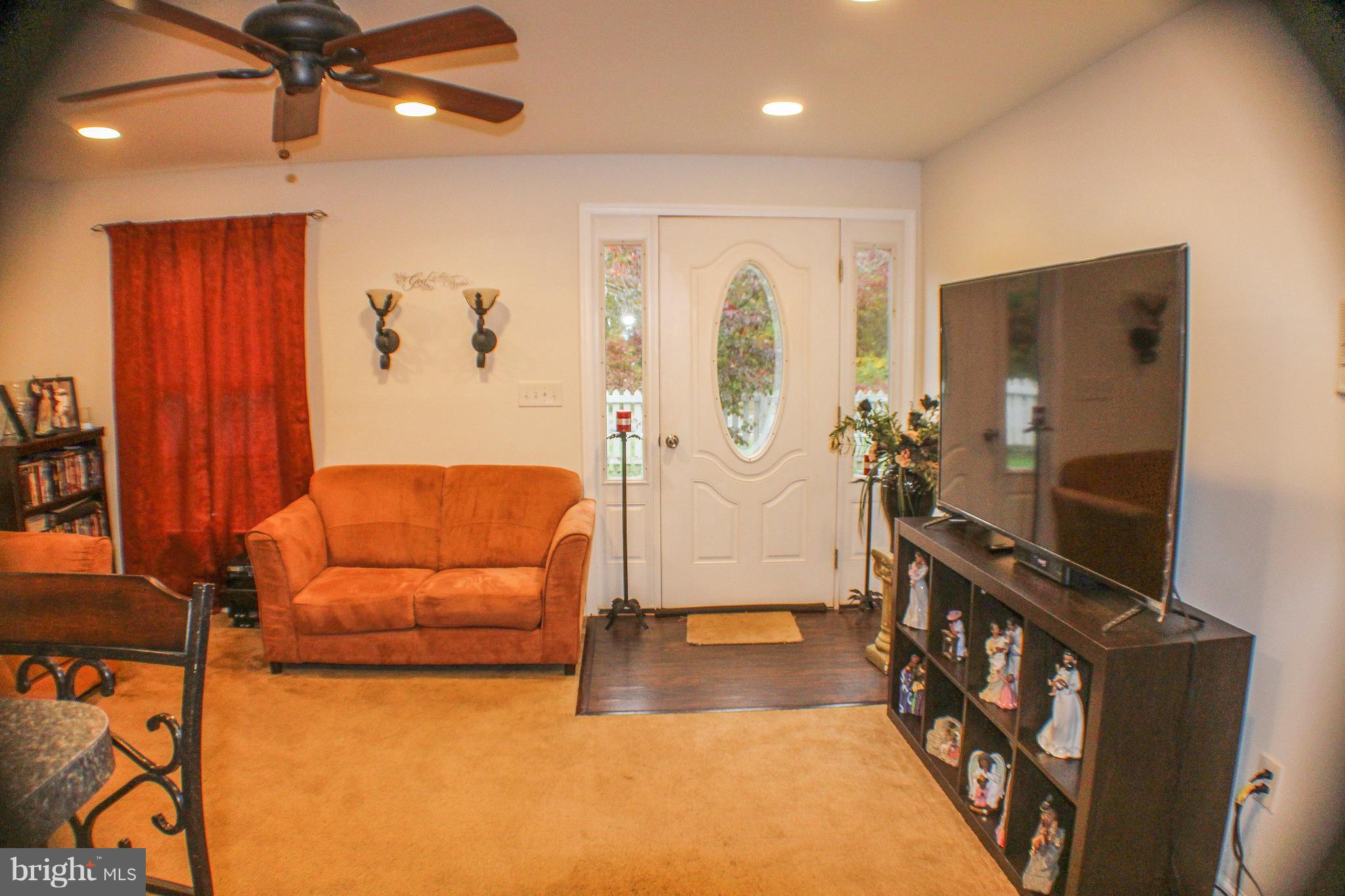 4155 Smallwood Church Road Indian Head, MD 20640 - Photo 10 of 30 a living room with furniture a flat screen tv and a window