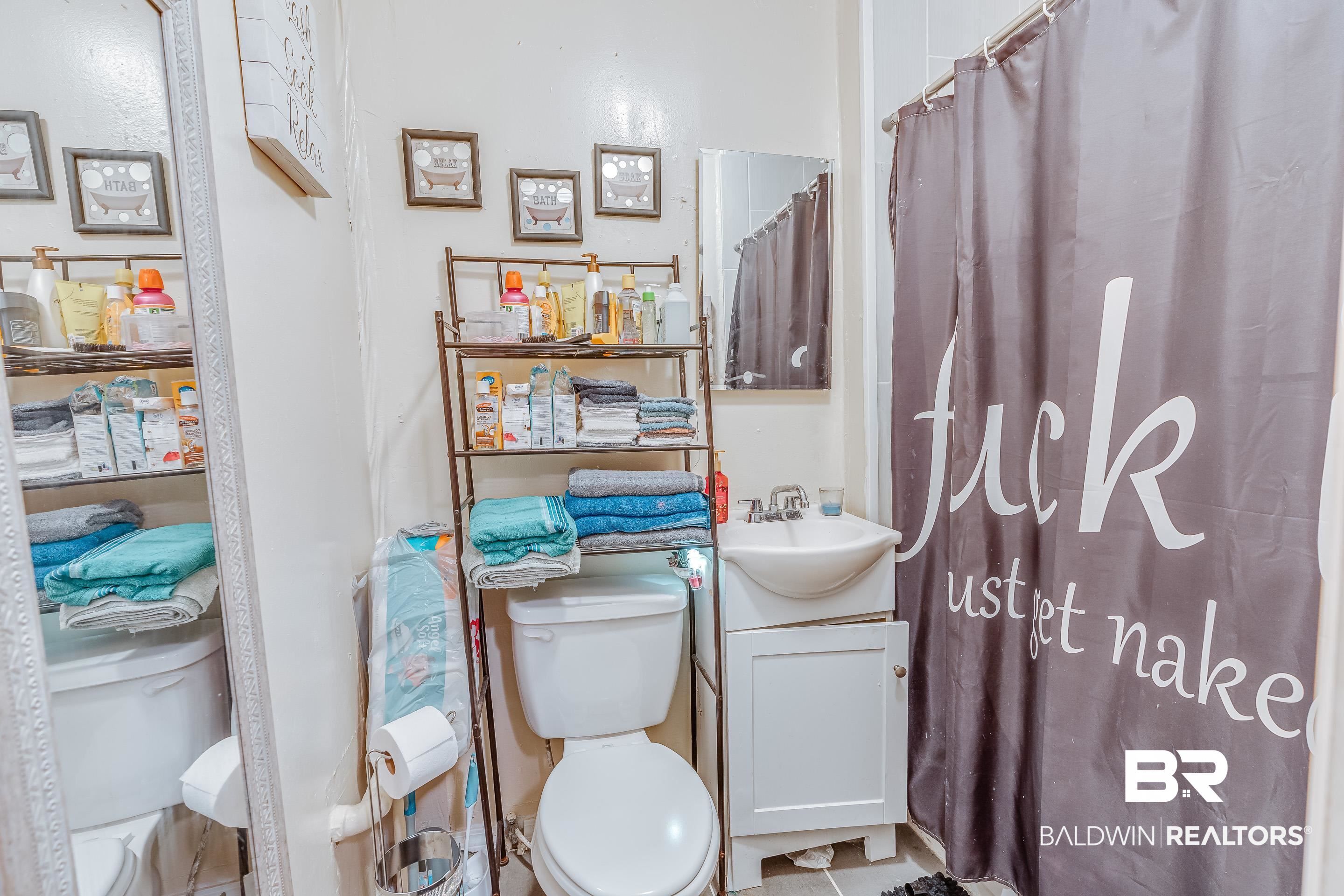 14 Southern Street Mobile, AL 36611 - Photo 14 of 26 Bathroom with vanity and toilet