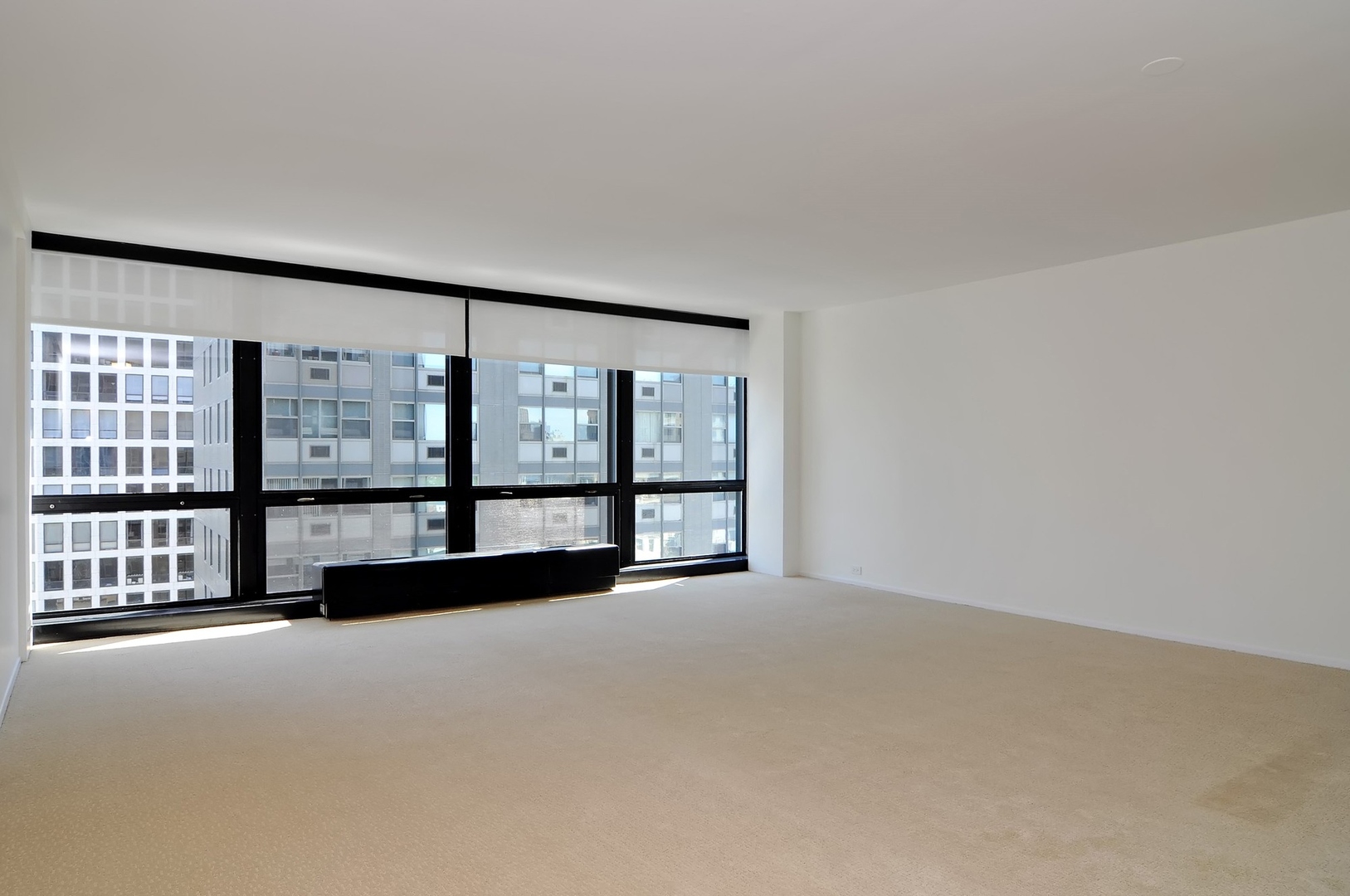 900 North Lake Shore Drive, Unit 1904 Chicago, IL 60611 - Photo 2 of 9 a view of an empty room with windows