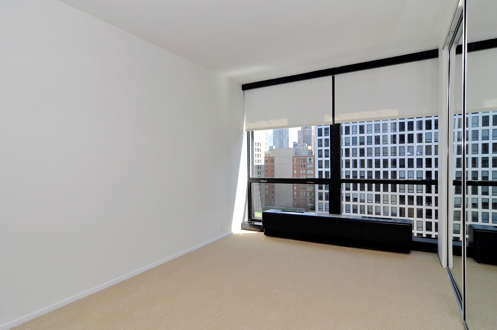 900 North Lake Shore Drive, Unit 1904 Chicago, IL 60611 - Photo 5 of 9 a view of an empty room with a window