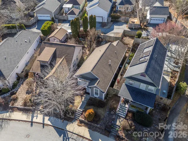 a sign that is sitting on a sidewalk