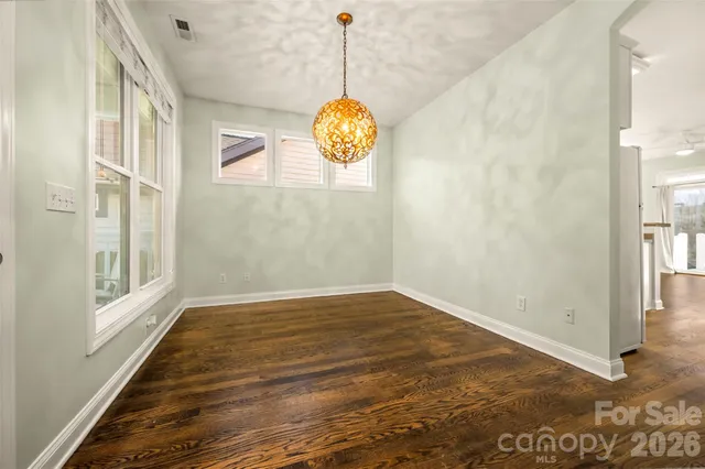 a view of an entryway with wooden floor