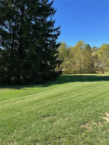 a view of outdoor space with deck and yard