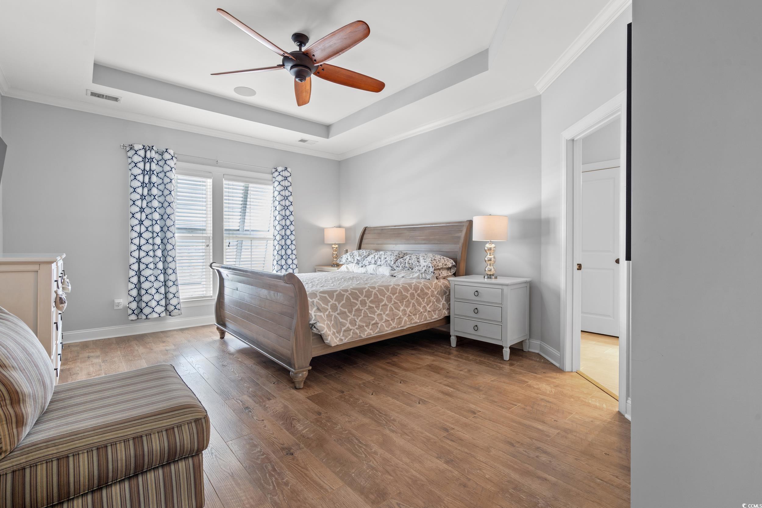 277 Splendor Circle Murrells Inlet, SC 29576 - Photo 12 of 38 Bedroom featuring a tray ceiling, hardwood / wood-