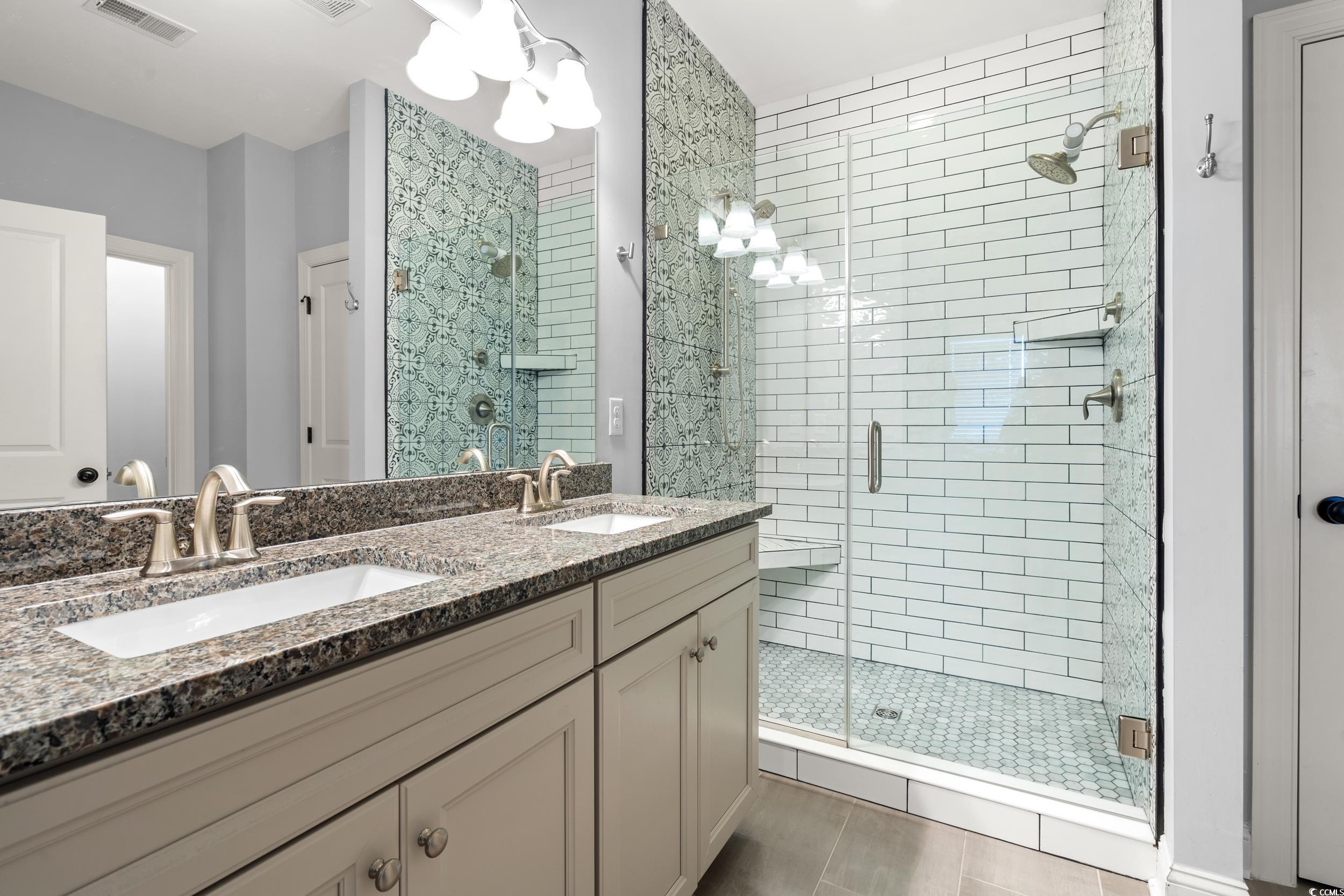 277 Splendor Circle Murrells Inlet, SC 29576 - Photo 14 of 38 Bathroom with a stall shower, double vanity, and t