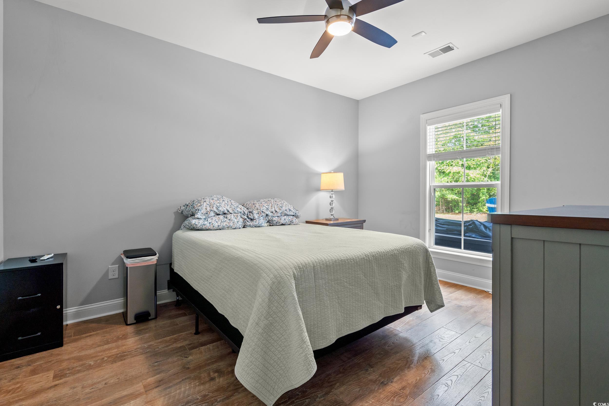 277 Splendor Circle Murrells Inlet, SC 29576 - Photo 15 of 38 Bedroom with wood finished floors and ceiling fan