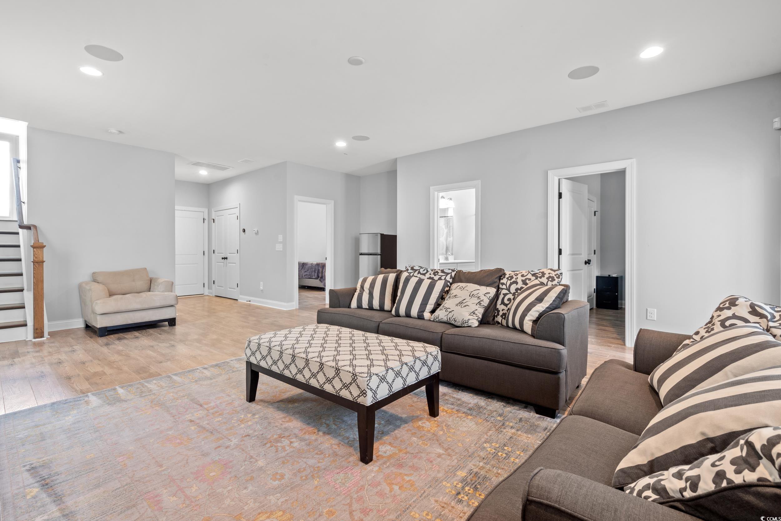 277 Splendor Circle Murrells Inlet, SC 29576 - Photo 19 of 38 Living room featuring light wood-type flooring, st