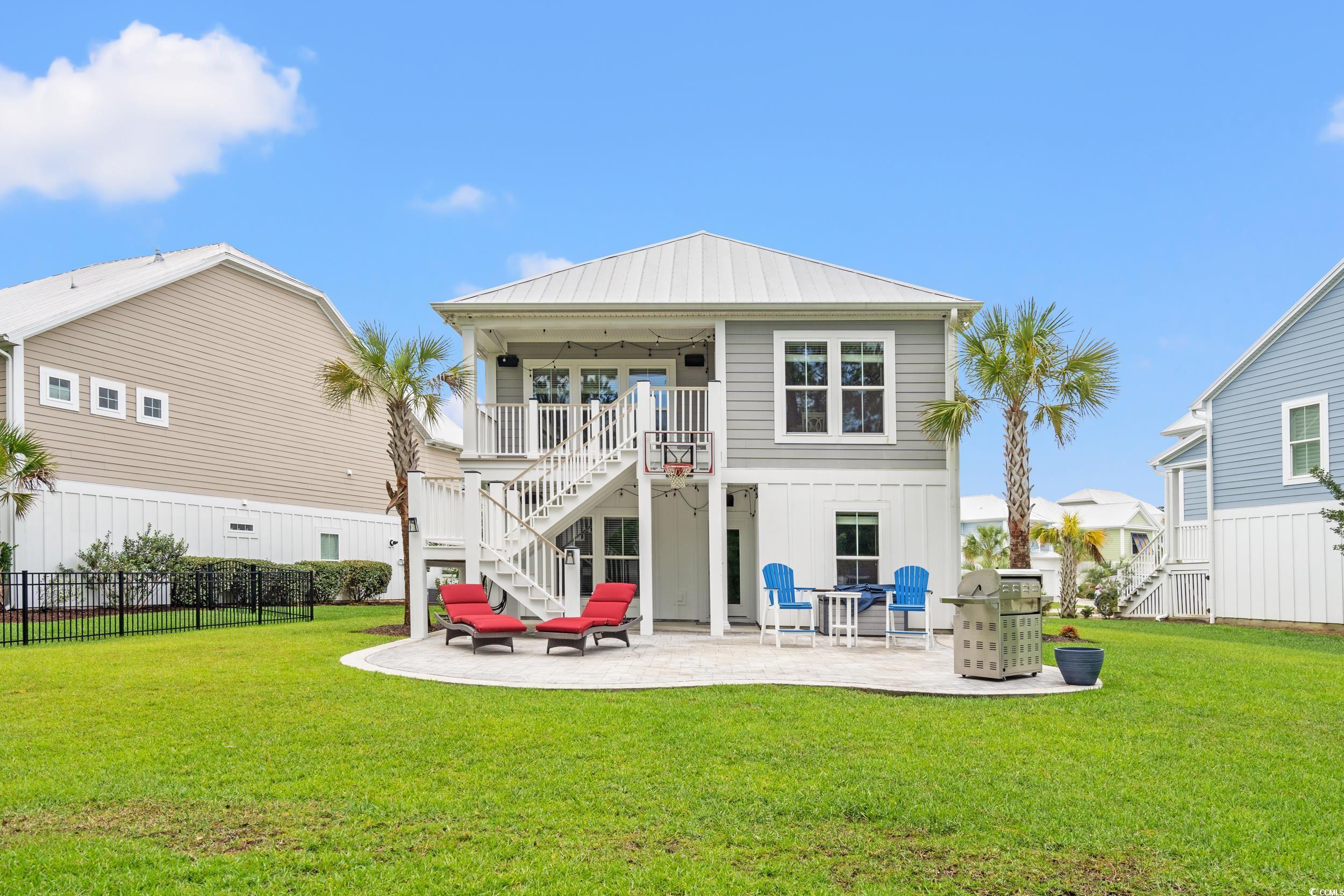 277 Splendor Circle Murrells Inlet, SC 29576 - Photo 24 of 38 Back of house featuring stairs, a patio, and board