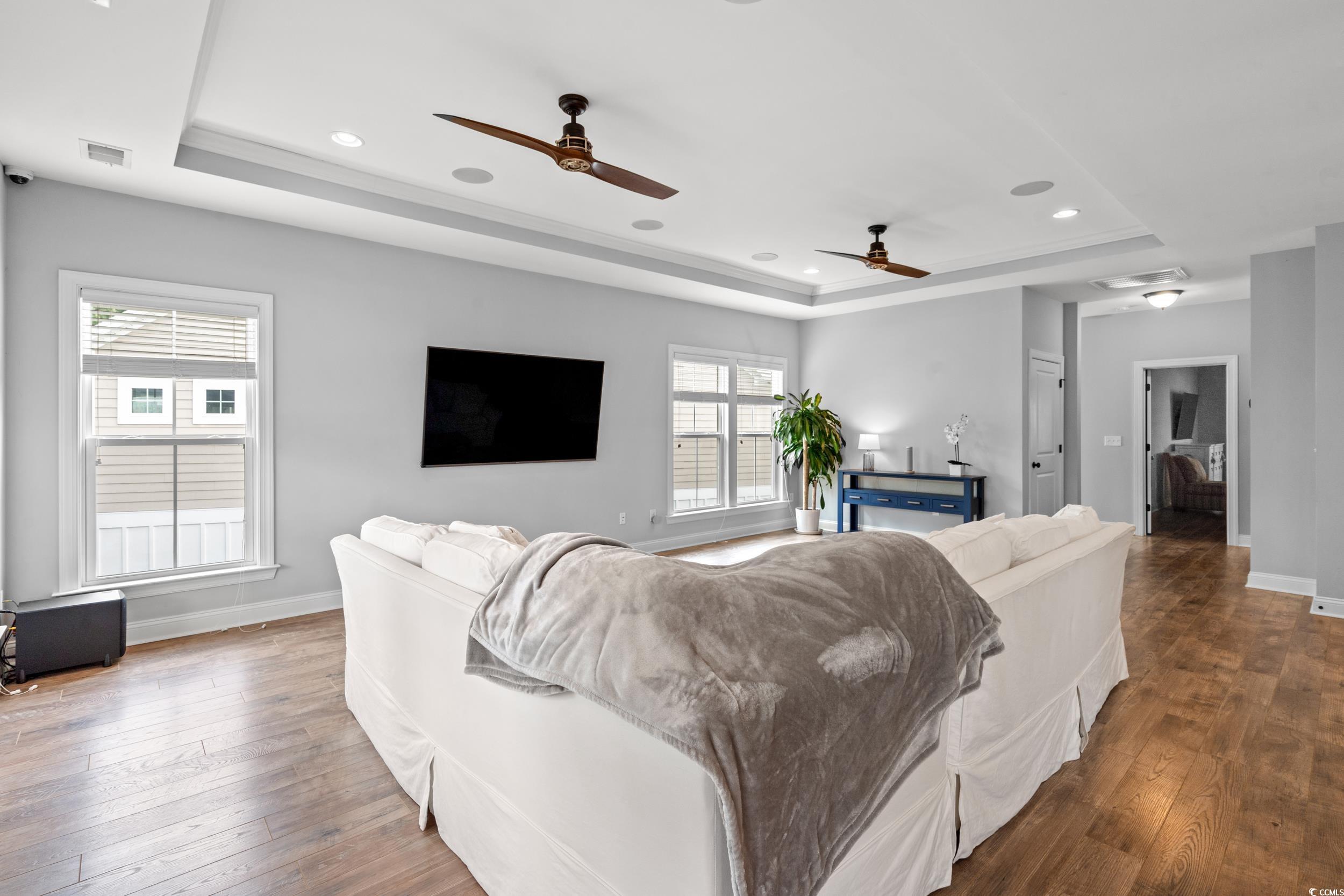 277 Splendor Circle Murrells Inlet, SC 29576 - Photo 3 of 38 Living room featuring a tray ceiling, hardwood / w