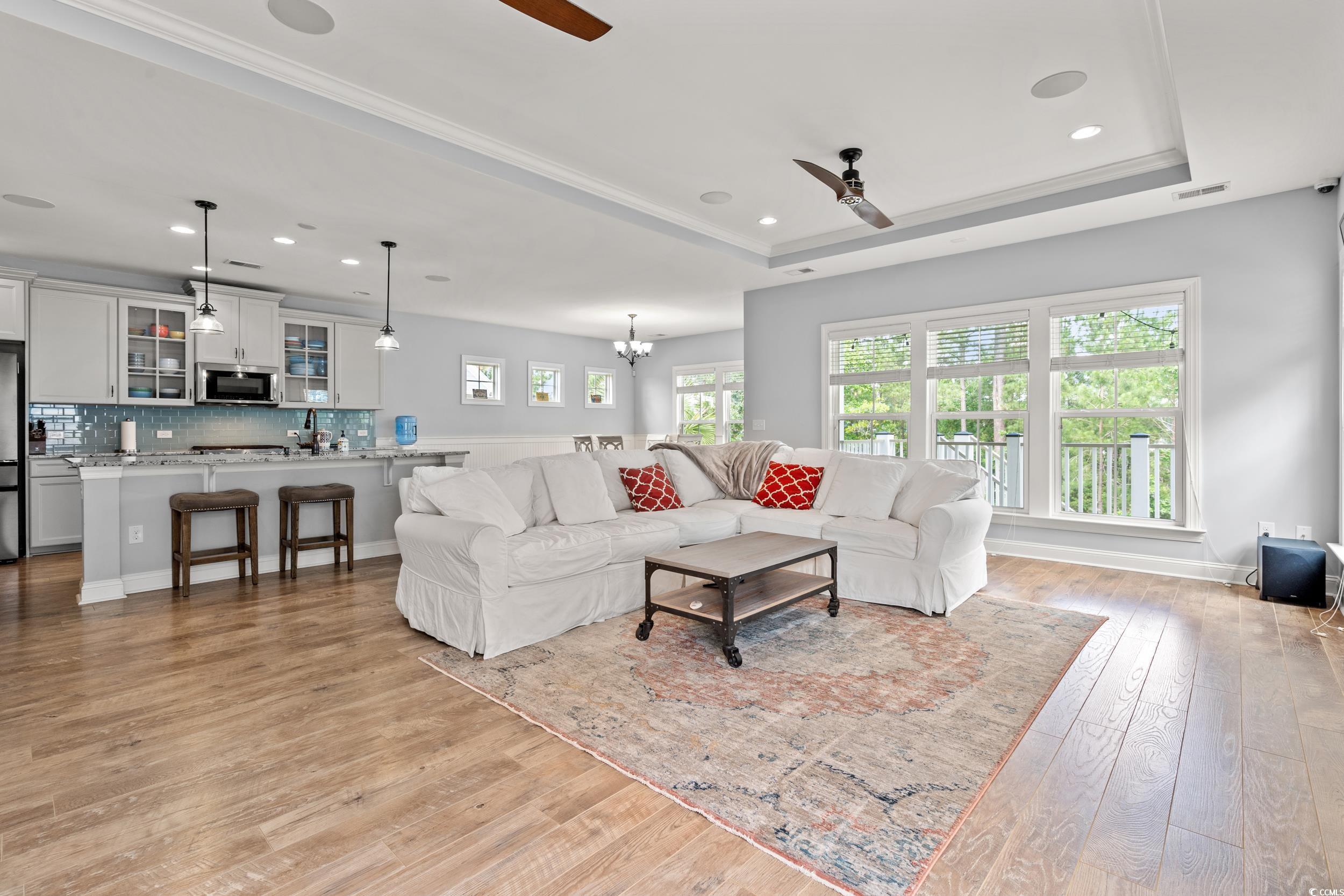 277 Splendor Circle Murrells Inlet, SC 29576 - Photo 4 of 38 Living room with ceiling fan, light wood-type floo