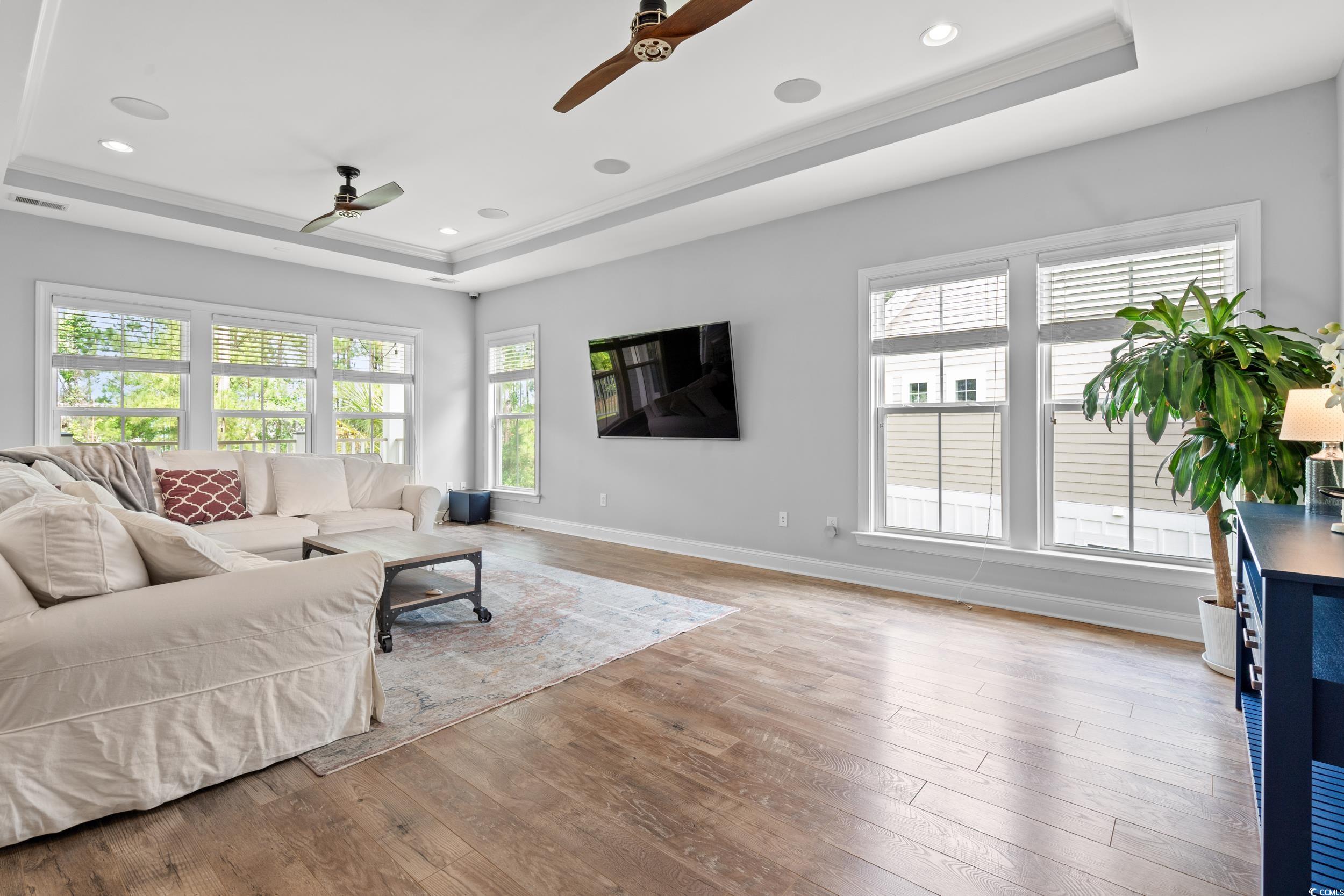 277 Splendor Circle Murrells Inlet, SC 29576 - Photo 6 of 38 Living area with ceiling fan, a raised ceiling, ha