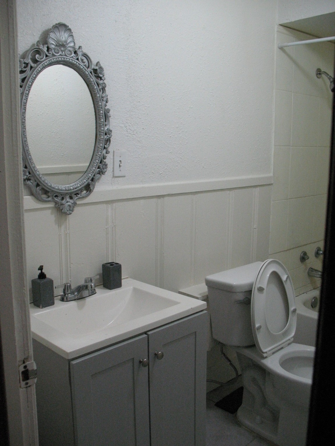 2610 Scott Street Houston, TX 77004 - Photo 9 of 10 a bathroom with a sink and a mirror