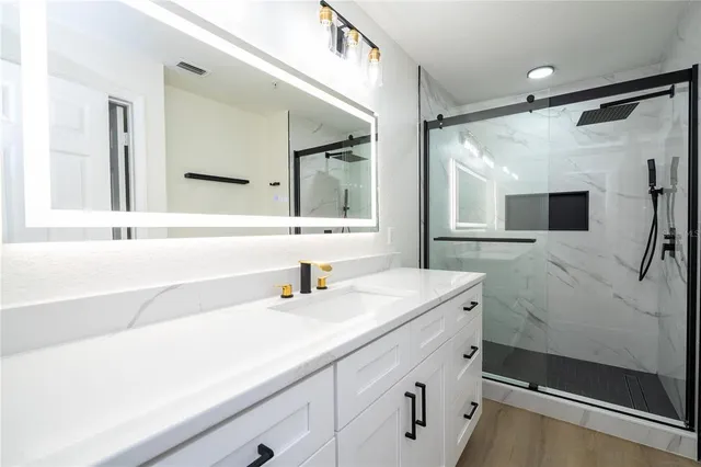 a bathroom with a sink and a mirror