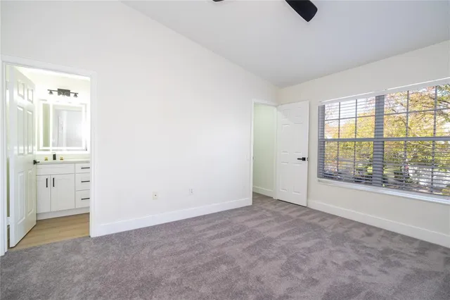 an empty room with a empty space and windows