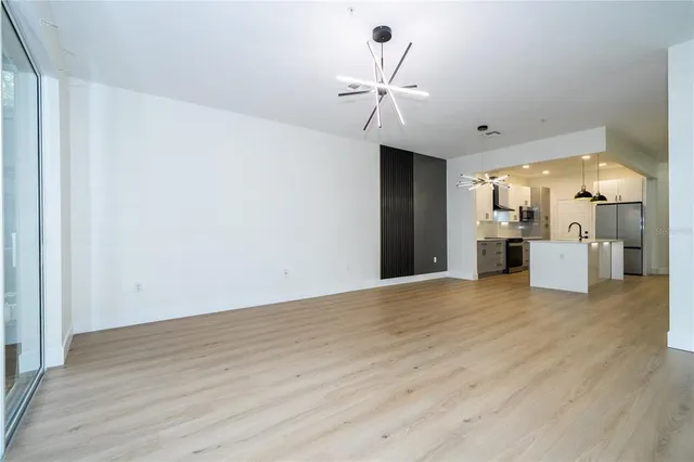 a view of a kitchen with a sink and cabinet with wooden floor
