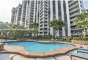 a view of swimming pool with chairs