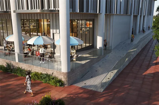 a view of a patio with table and chairs with wooden floor and fence