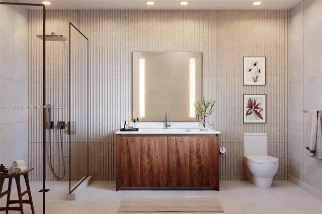 a bathroom with a toilet a sink and mirror